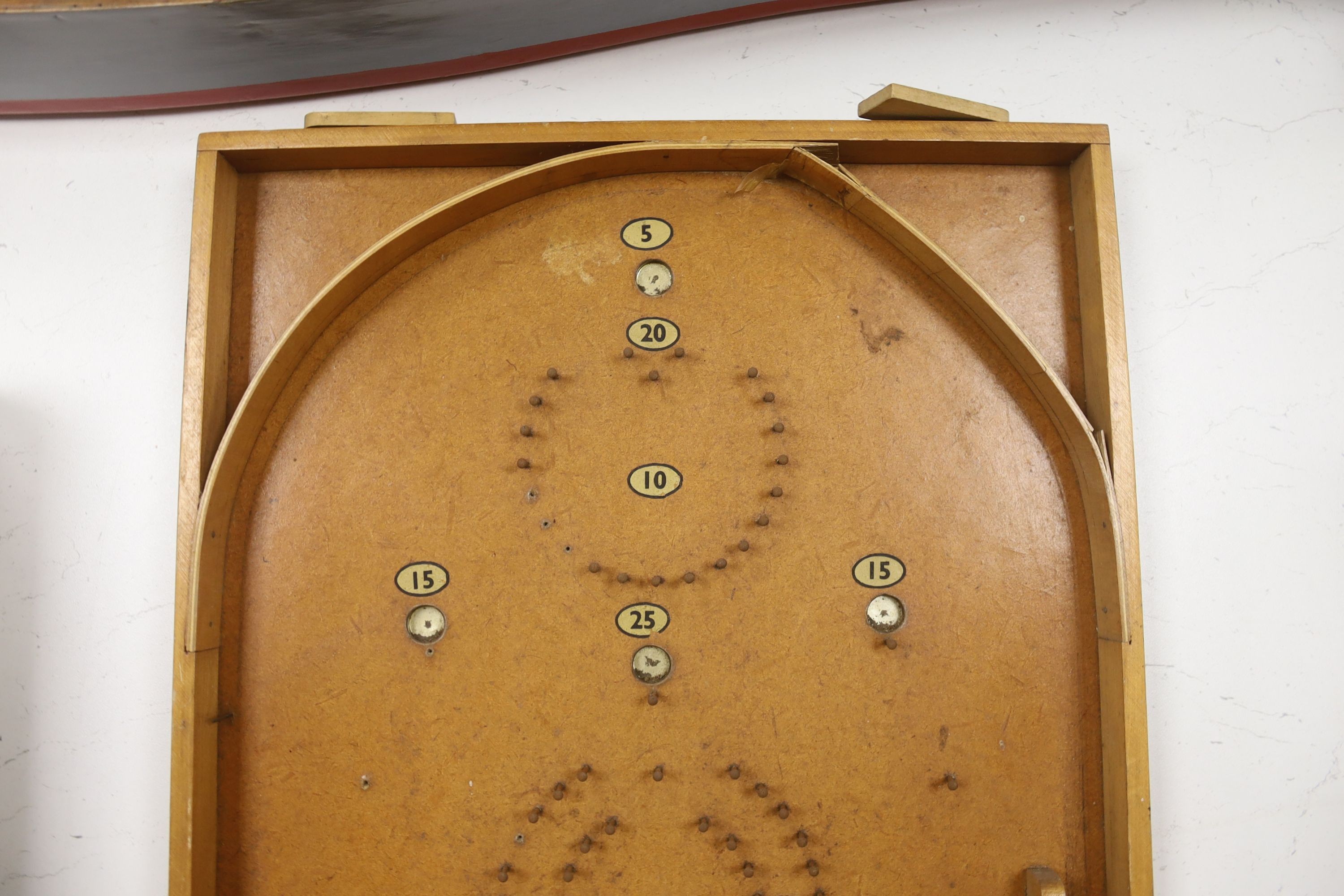 A vintage bird scarer and a Chad Valley bagatelle board